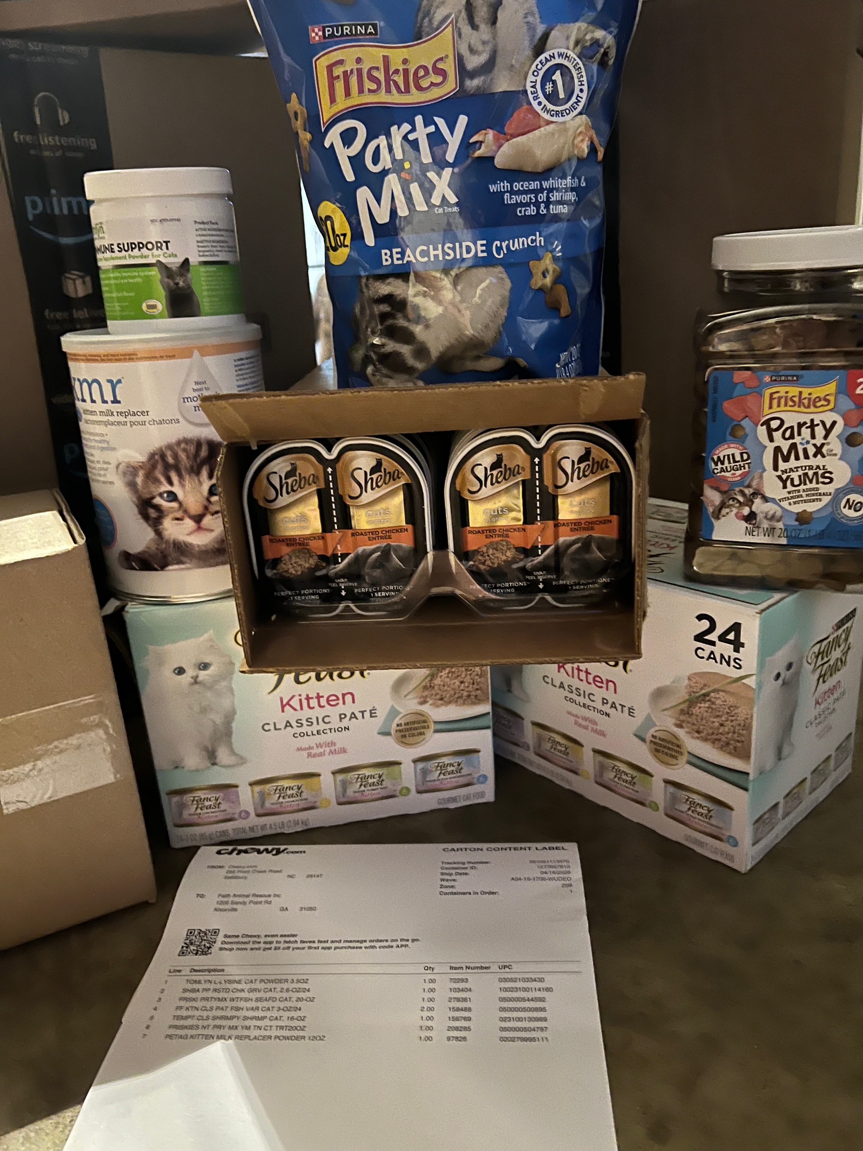 Sheba, Friskies and Fancy Feast cat food donations with Chewy receipt