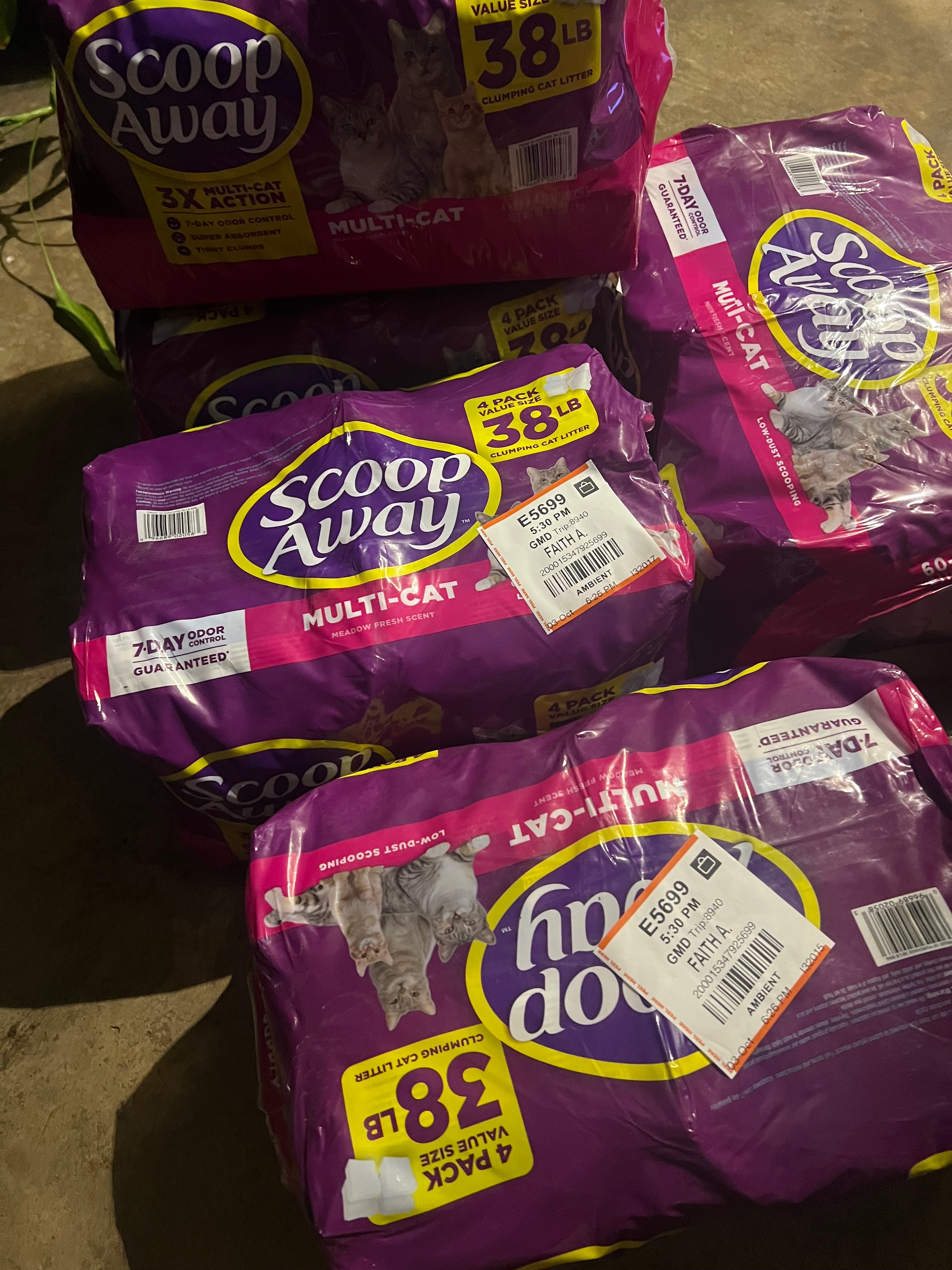 Scoop Away cat litter bags with store receipt tags