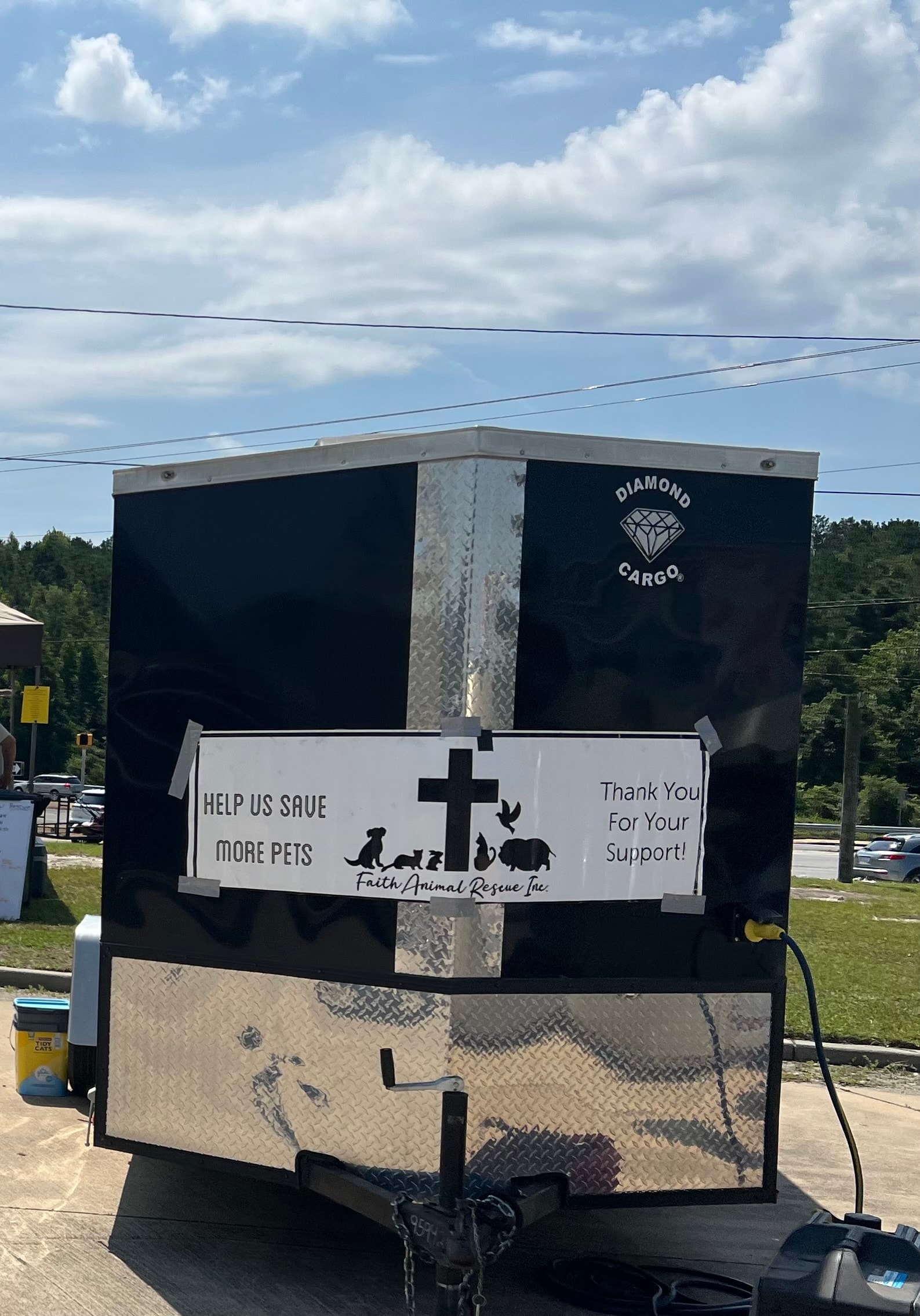 Diamond Cargo trailer with Faith Animal Rescue Help Us Save More Pets banner